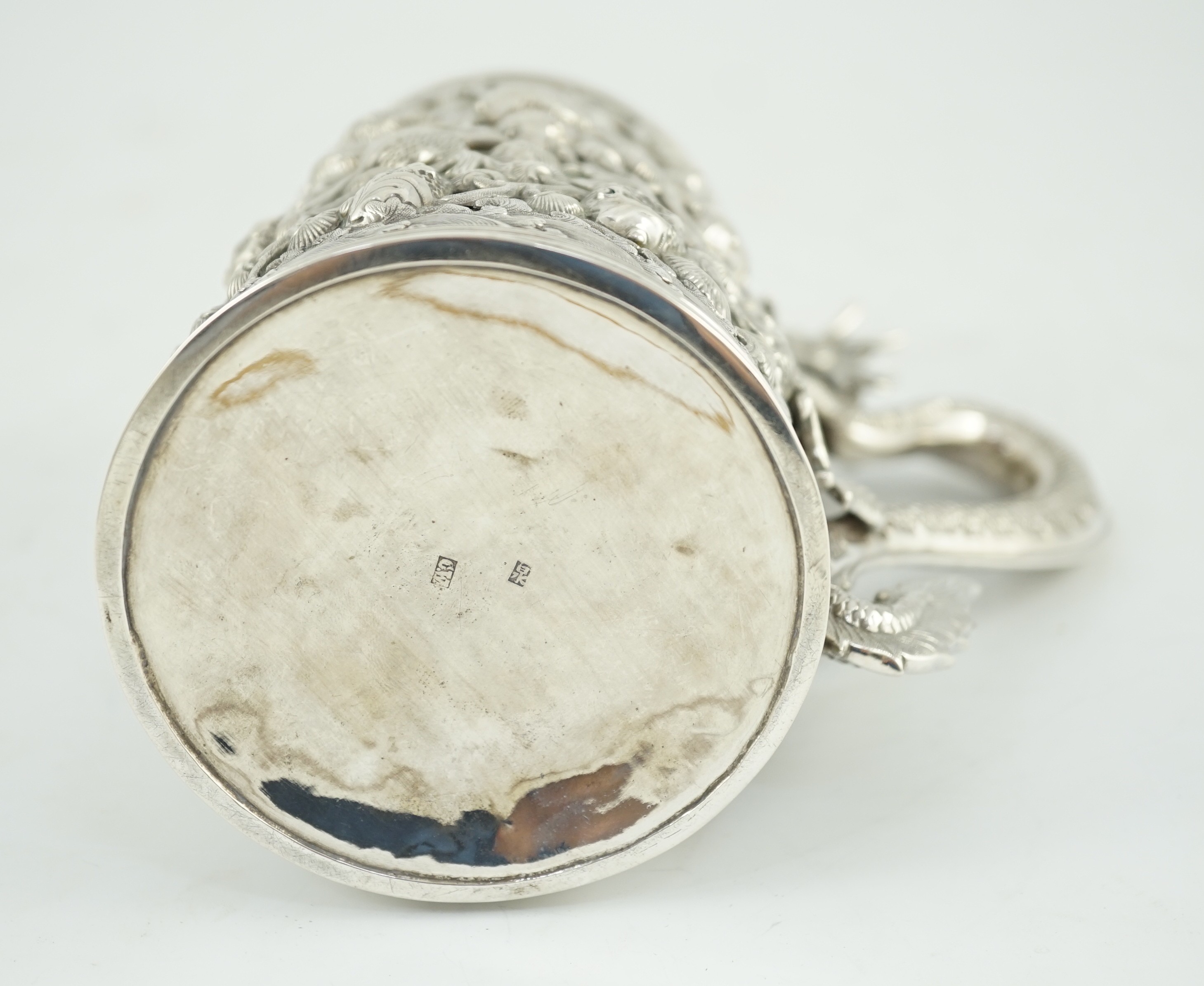 A late 19th century Chinese Export double skinned silver mug, by Cumwo